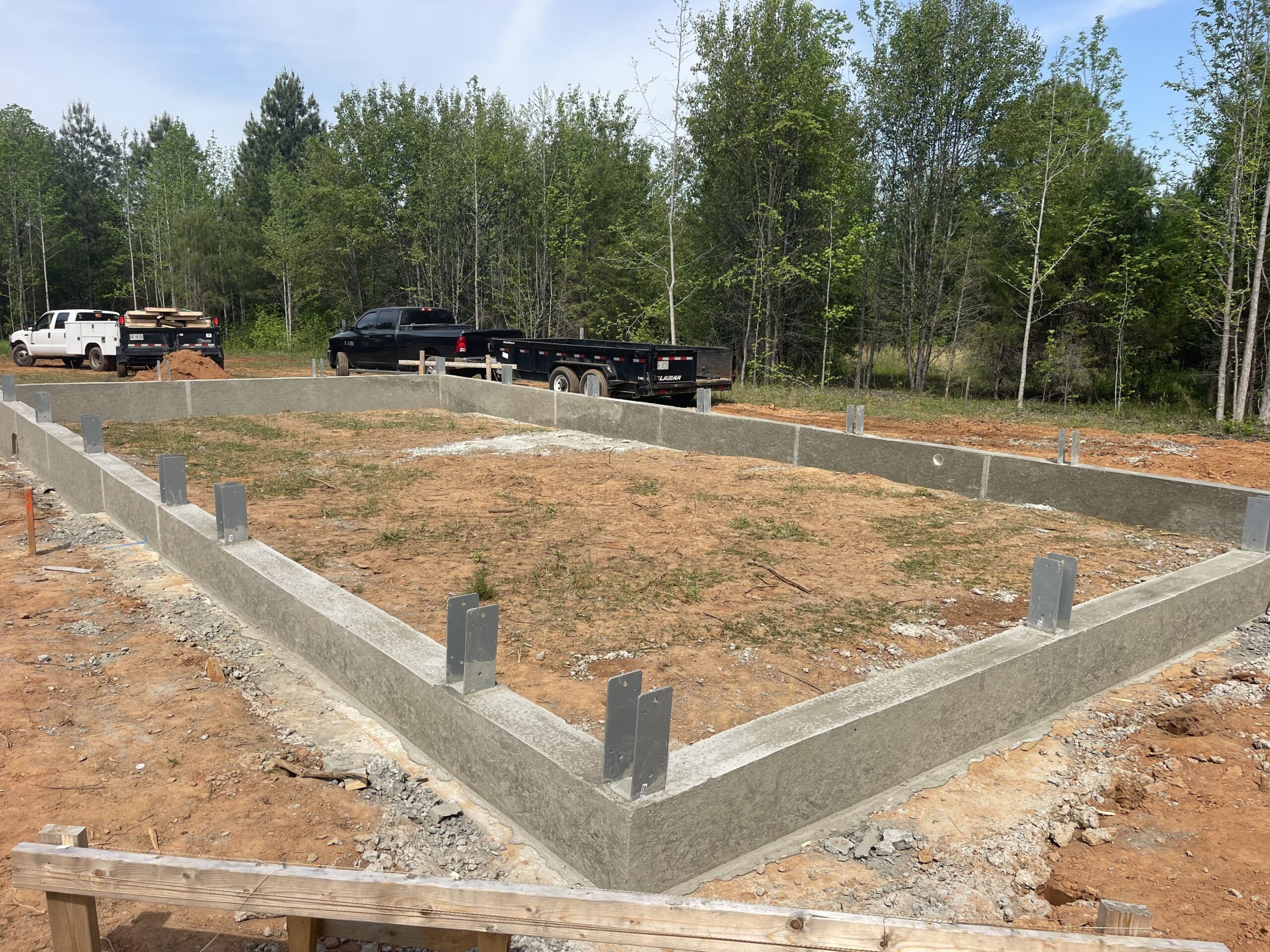 Footing and foundation work for a construction project, highlighting the base structure and preparation for the outdoor living space built by Mazzucco Construction.